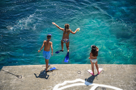 Kids swimming on Andros Island Greeceの写真素材