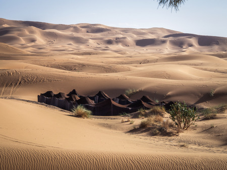 Berber camp in the sand dunes of the Sahara Desert in Morocco.の写真素材