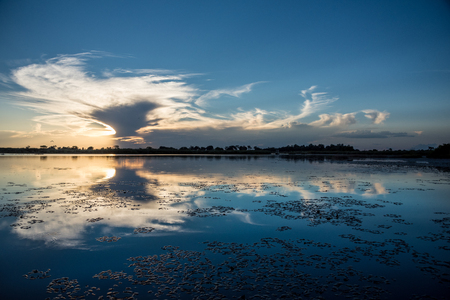 Sunset over the water on the Okavango Delta Botswanaの写真素材