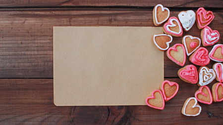 background with heart shape valentine homemade cookies on wooden background with space for textの写真素材