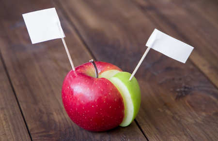 white flags thumbtack on chart made from apple. creative business conceptの写真素材