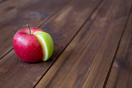apple pie chart made from green sector in a red circle. creative concept. space for textの写真素材