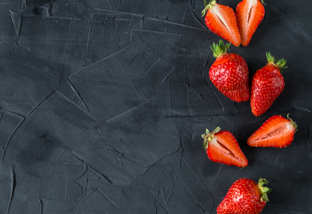 Fresh strawberries on concrete background. top view. space fot textの写真素材
