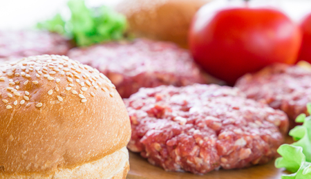 The raw ingredients for the homemade burger on country background. Top view.の写真素材