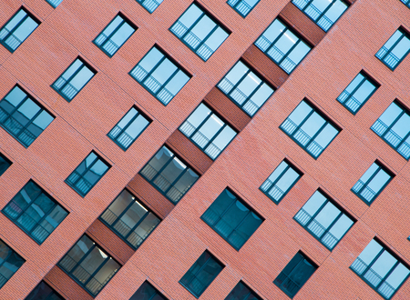 frontal view of Architectural Exterior Detail of Residential Apartment Building with Brick Facadeの写真素材
