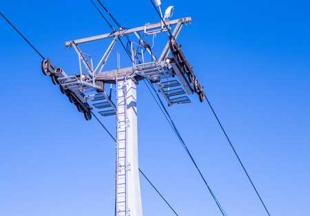 close up of cable car railway against blue skyの写真素材