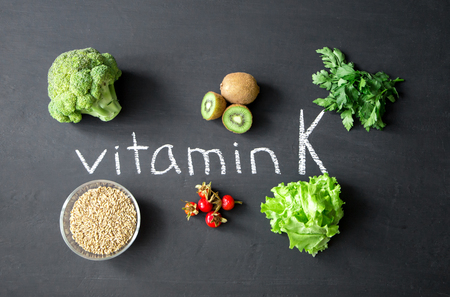 Foods highest in Vitamin K on a chalky board. Healthy eating. Top viewの写真素材