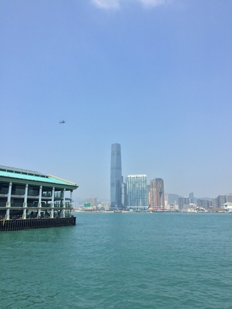 Helicopter on the background of high-rise buildings located on the seafrontの写真素材