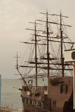 Installation of a sailing ship on the waterfrontの写真素材