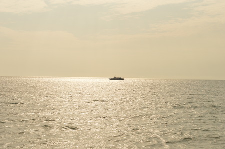 Pleasure boat on the background of autumn seaの写真素材