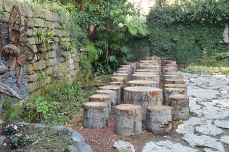 Area in the Park bench from scraps of tree trunkの写真素材