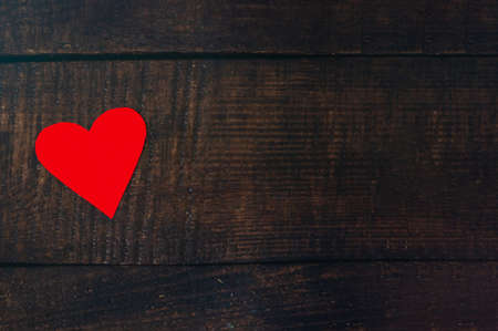 White hearts over red hearts on the wooden floor.の写真素材