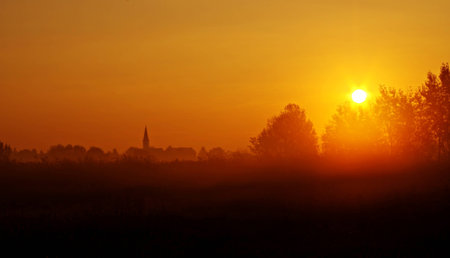 Silhouette on a foggy morningの写真素材