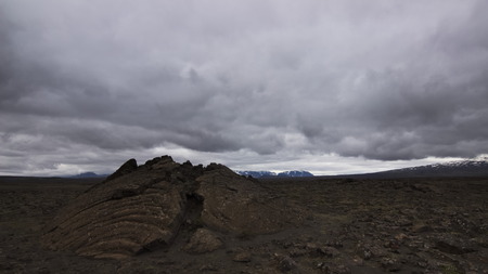 A fissure on a lava field along the backcountry mountain road F35 in interior highlands of Iceland with overcast sky.の写真素材