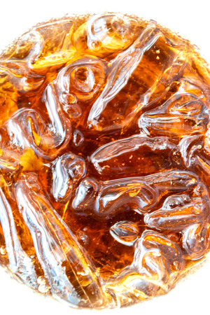 Glass of soft drink with ice in top view.の写真素材