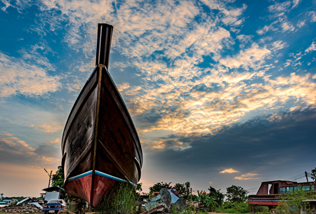 Ship waiting for repair in the shipyard in sunset of the day.の写真素材