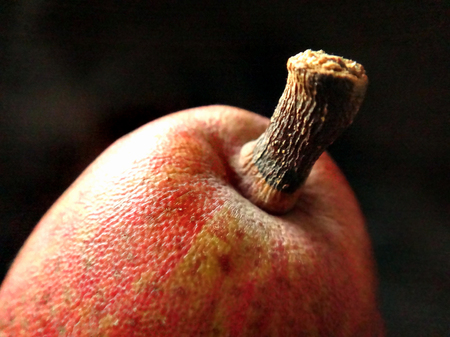 Close-up image of red pear, black backgroundの写真素材