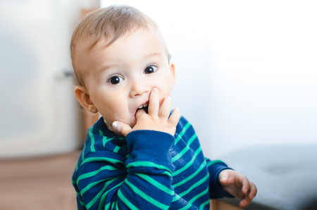 Child eating sugarの写真素材