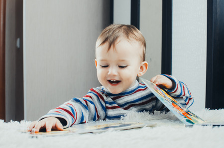 The child looks the book is very passionate about his occupation, likeの写真素材