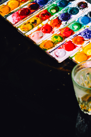 The paint went on wet black surface, beautiful background, creativityの写真素材