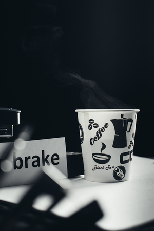the black background of the inscription a break for coffee, paper Cupの写真素材