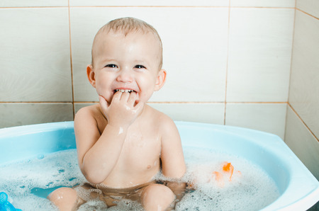 Handsome boy preschooler bathing in the bathroom clean and hygienic