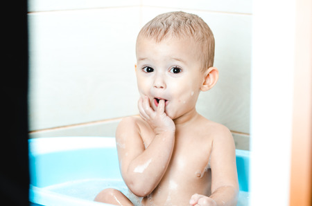 Handsome boy preschooler bathing in the bathroom clean and hygienic
