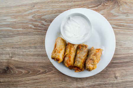 stuffed cabbage - a traditional Ukrainian cuisine braised cabbage leaves stuffed with minced meat and rice with sour creamの写真素材