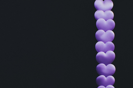 Many purple hearts in the form of frames and space for lettering designersの写真素材