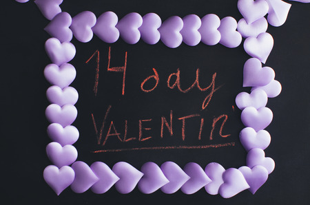 Many purple hearts in the form of frames and space for lettering designersの写真素材