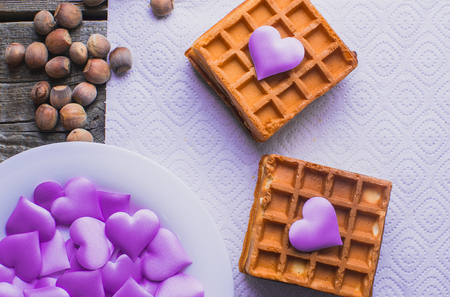 Homemade waffles on a wooden background hearts, purple, Valentine's dayの写真素材