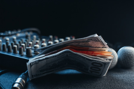 Music equipment, microphones, console and the money to pay the feeの写真素材