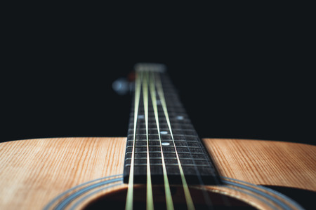part of the guitar, neck, a grey and black background, beautifully, elegantlyの写真素材