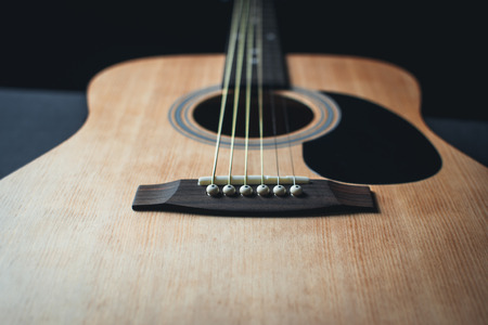 part of the guitar, neck, a grey and black background, beautifully, elegantlyの写真素材