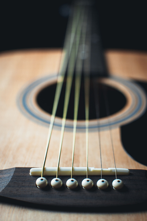part of the guitar, neck, a grey and black background, beautifully, elegantly