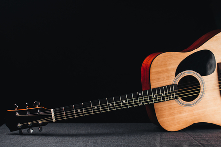 part of the guitar, neck, a grey and black background, beautifully, elegantlyの写真素材