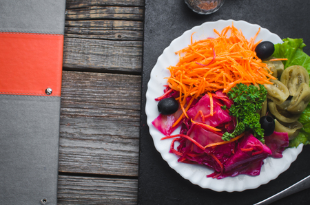 on a wooden background on a plate, are pickles, marinades, and sunsetsの写真素材
