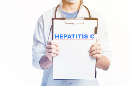 Doctor with a clipboard, blank template written diagnosis of HEPATITIS C there is empty spaceの写真素材