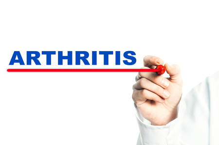 Hand draws a red line marker, emphasizes the important inscription medical ARTHRITISの写真素材