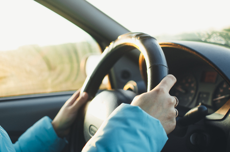 Selected focus Woman is hands on the steering wheel of the carの写真素材