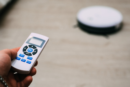 closeup remote control of robotic vacuum cleanerの写真素材