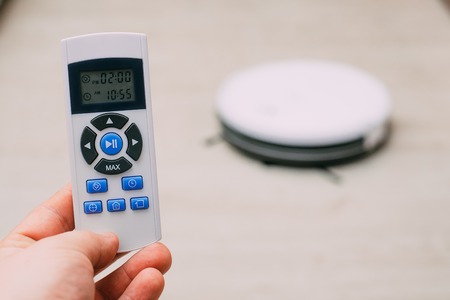 closeup remote control of robotic vacuum cleaner