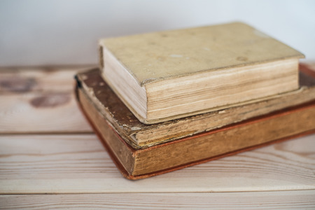 Three books lying on each other old yellow pagesの写真素材