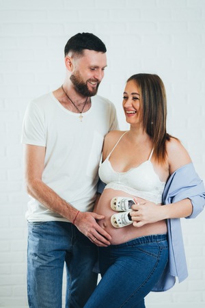 Pregnant girl with her husbandの写真素材