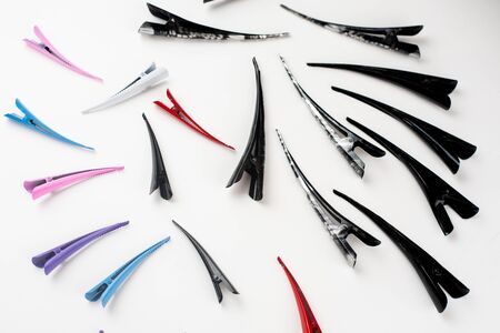 Black and gray clips and colored ones on a white background coolの写真素材