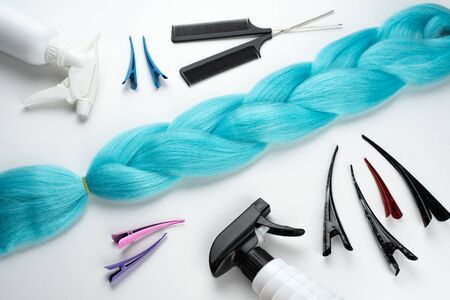 Kanekalon artificial blue hair for braiding and Afro hairstyles , lying on a white background next...