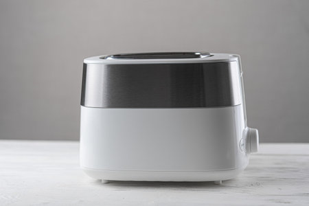 White with silver toaster on gray background