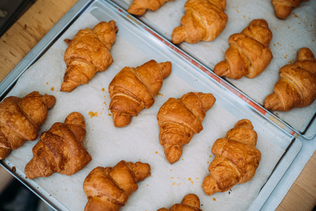 Fresh croissants, taken out of the oven, ready to eat