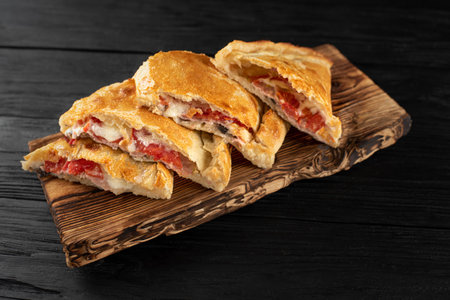 Juicy sandwiches on wooden board black backgroundの写真素材