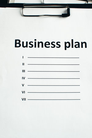 Workstation, a notebook with hand drawn business strategyの写真素材